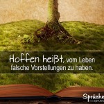 Buch mit Wiese, aus dem ein Baum wächst