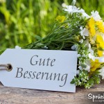 Blumenstrauß mit einem Schild Gute Besserung